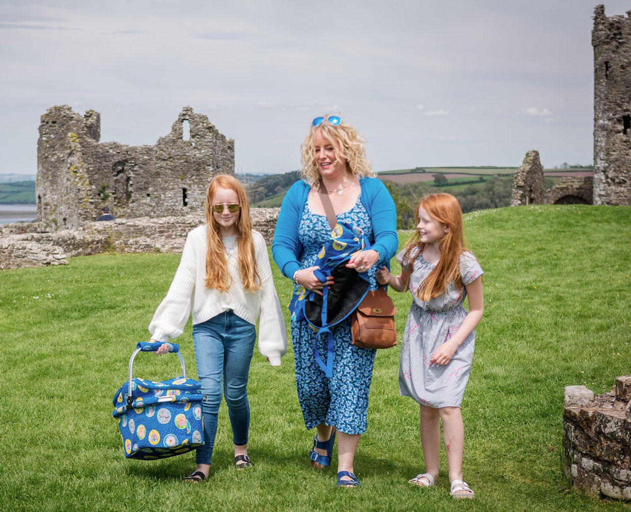 Adult with two children walking in Carmarthenshire