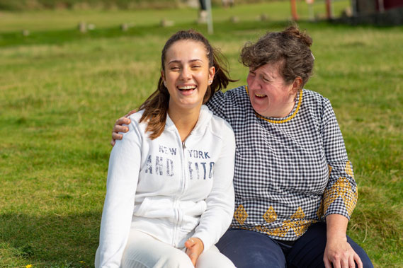 Adult and teen laughing