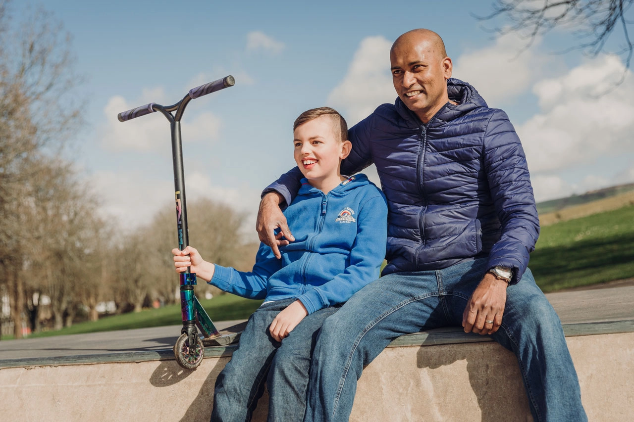 Man and boy at a skatepark