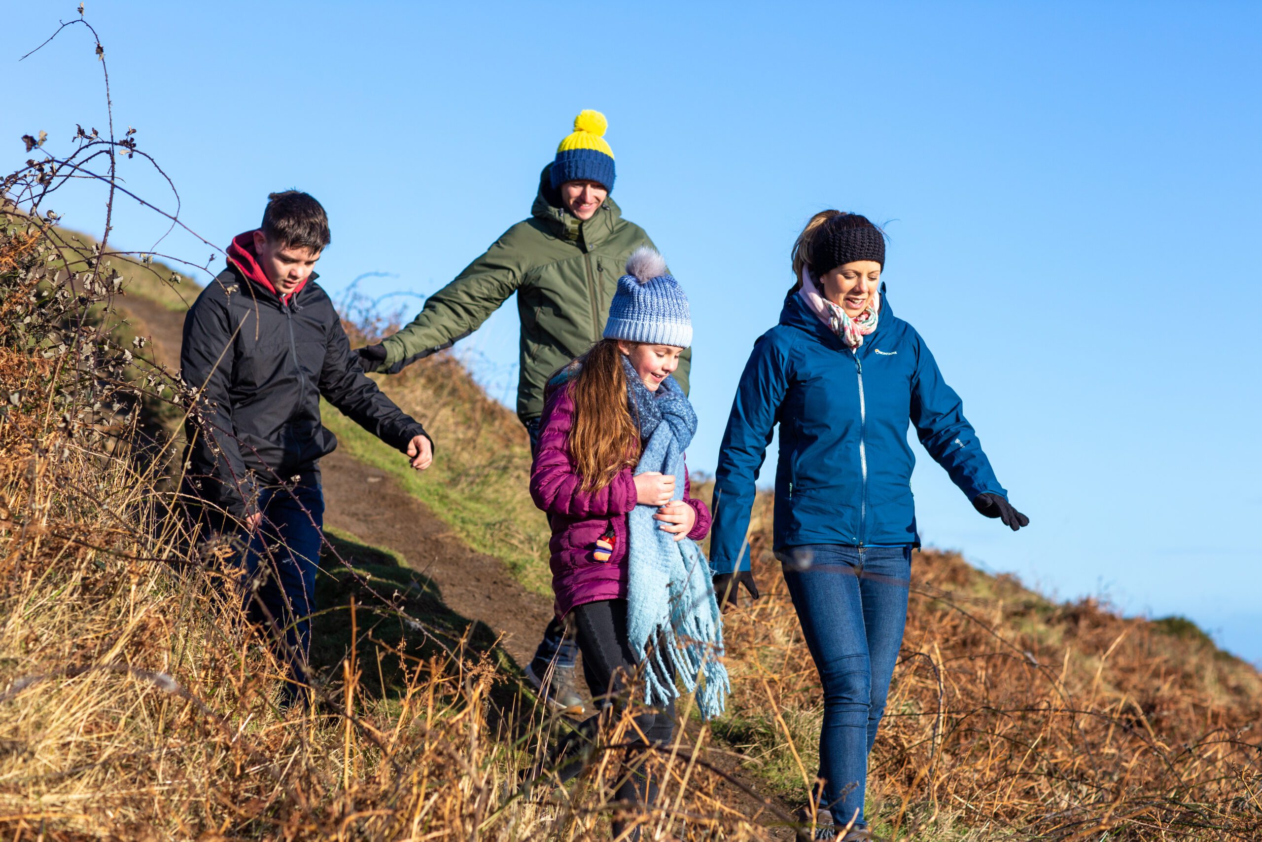 Foster family walking down hill